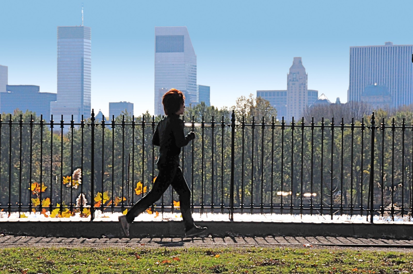 Man jogging in park, getting exercise benefits