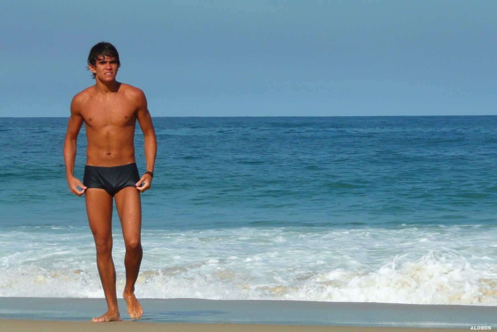 healthy lifestyle, tanned man at beach
